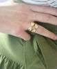 Bow Ring in peridot and emerald stones. 