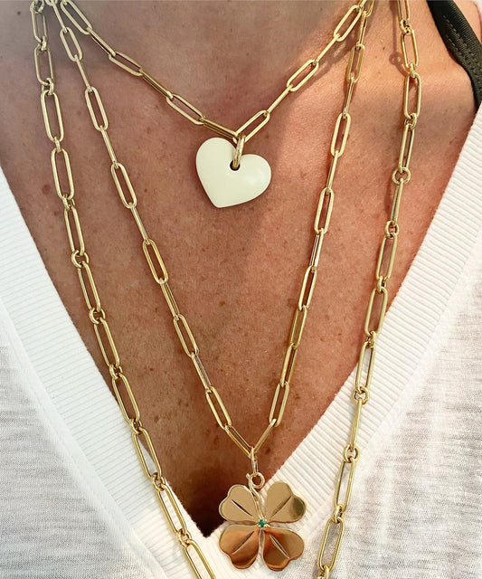 White Heart Pendant with a Gold Necklace