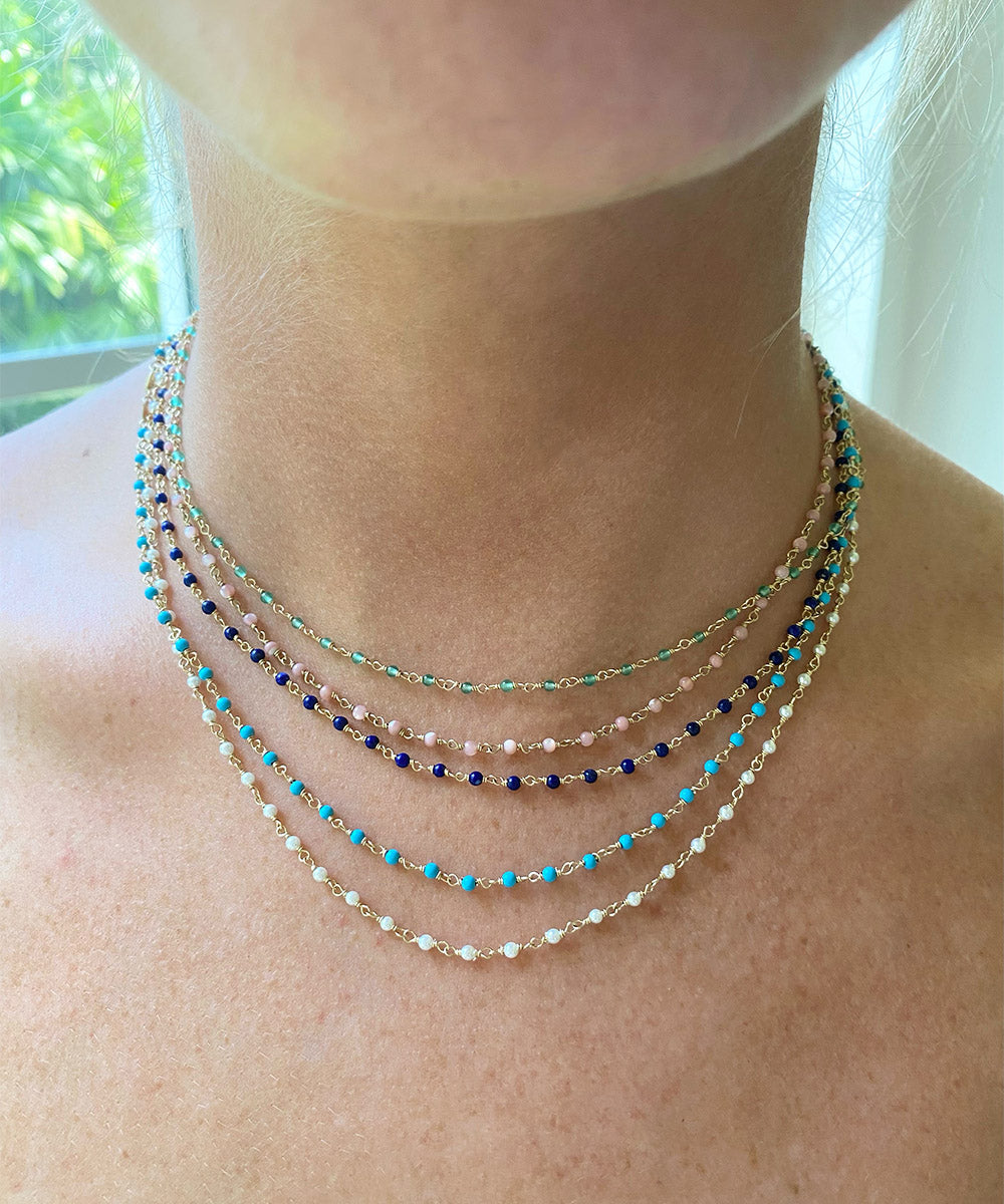 Delicate beaded necklace with a dainty chain and small beads in a elegant design